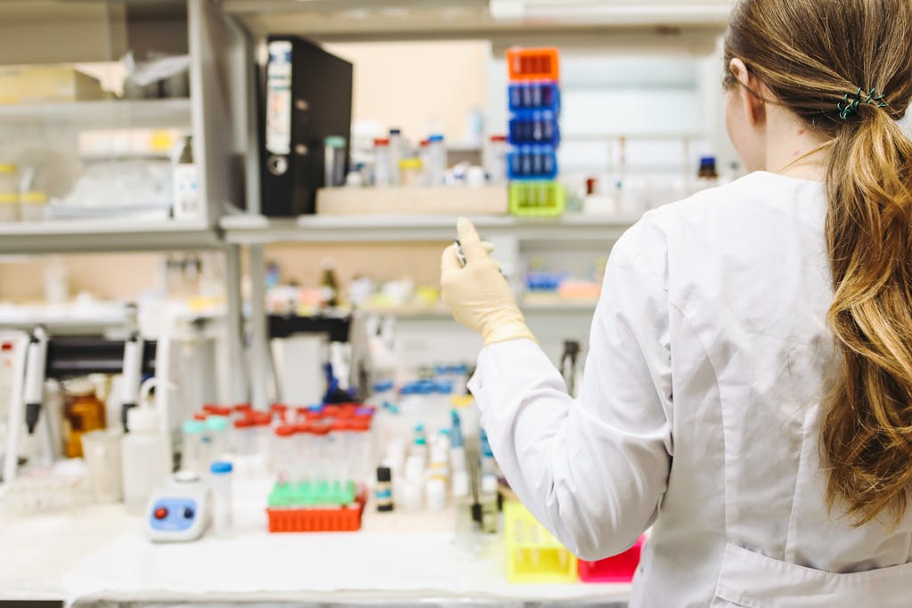 Woman In White Laboratory Gown